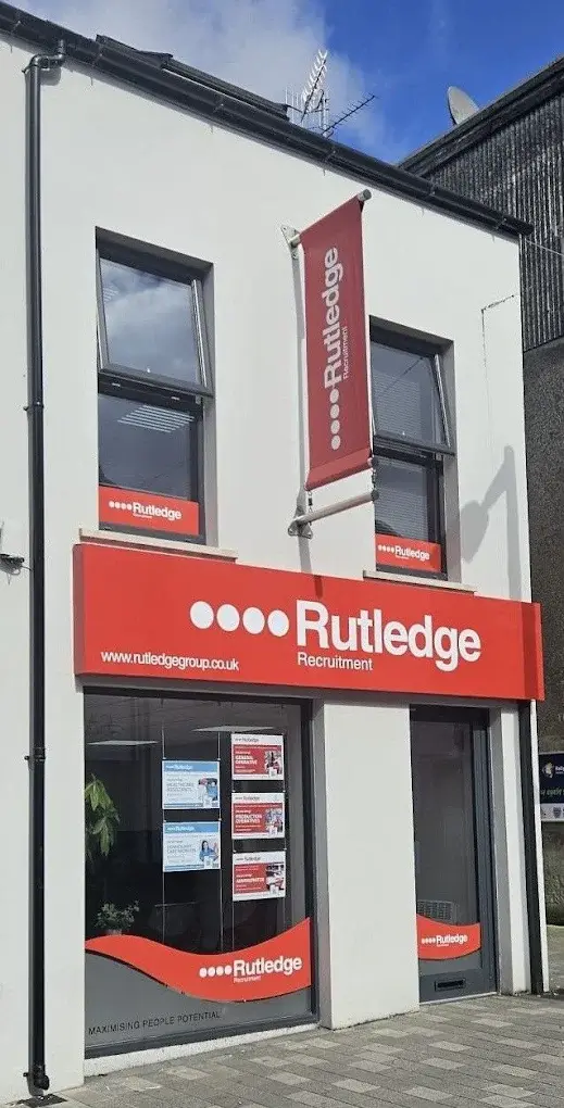 Rutledge Recruitment & Training Ballymena Greenvale Street branch, white building with bold red Rutledge shopfront signage and vertical banners.