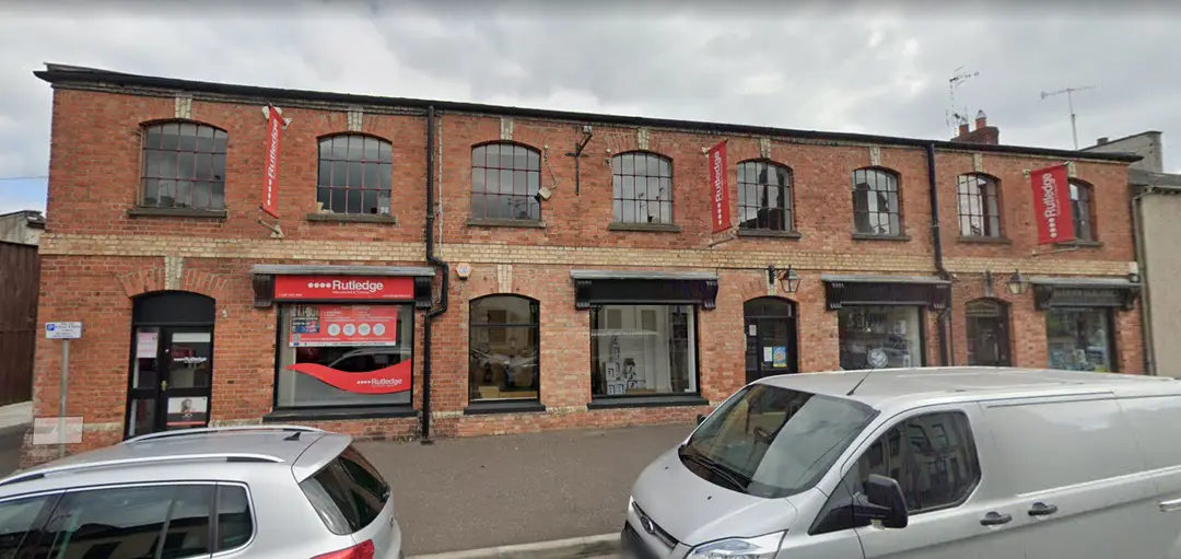 Rutledge Recruitment & Training Magherafelt branch, red-brick building with Rutledge banners and shopfront signage.